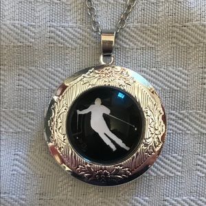 New! Silver locket with skiing image on front